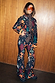 Night Garden Ski Suit with leopard and mystical motifs, featuring a belted waist and styled with orange visor goggles.