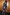 Thumbnail for Night Garden Ski Suit featuring a hooded back view with leopard and mystical motifs in a patchwork print.