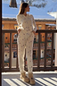 Thumbnail for White Ski Waffle Pyjamas with a ski print, long-sleeved top and slim trousers, styled on a snowy balcony.