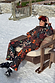 Night Garden Ski Suit in a black multi-motif print with leopard and poppy details, featuring a belted waist.