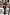 Thumbnail for Night Garden Ski Suit featuring iconic leopard and poppy prints, styled on a model in a snowy resort.