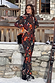 Night Garden Ski Suit featuring iconic leopard and poppy prints, styled on a model in a snowy resort.