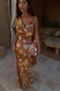 Brown Star Fawn Sophie Dress with star and palm motifs, draped neckline and detachable scarf detail.