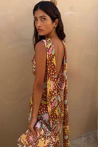 Star Fawn Sophie Dress in brown with a low back and detachable scarf detail, held with a matching clutch.