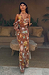 Star Fawn Sophie Dress in brown with celestial motifs, a draped front and detachable multi-wear scarf.
