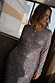 Gunmetal Sequin Soho Dress featuring long sleeves and a body-skimming silhouette covered in grey sequins.