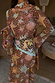 NFD Star Fawn Bandana in brown with celestial motifs, styled around the neck and waist for a multi-wear look.
