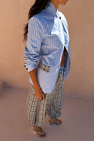 Blue Stripe Foldover Blazer with a high neck and contrast check tabs, styled with matching check trousers.