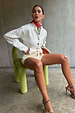 Ecru Studded Cardigan with silver studs on the sleeves, styled with matching shorts for a structured look.