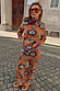 Thumbnail for Tan Sun knit co-ord with sun and swirl motifs, styled with a bandana and sunglasses on a cobbled street.