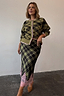 Olive Tartan Maeva Skirt featuring a contrast pink lace hem and green check print, styled with the matching cardigan.