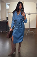 Teal Vegan Leather Jaspre wrap skirt styled with a matching blouse and brown boots in a studio mirror selfie.