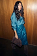 Teal Vegan Leather Jaspre Skirt styled with a matching teal shirt and a brown studded clutch.