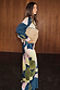 Teal Mara Abstract Dorris Skirt with a pink and olive print, styled as a co-ord with a matching top and tan clutch bag.