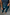 Thumbnail for Teal Vegan Leather Trousers in a straight leg fit, styled with a blue ribbed tank top and pointed tan heels.