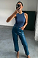 Teal Vegan Leather Trousers in a straight leg cut, styled with a blue rib tank top in a mirror selfie.