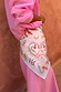 Cream Bandana in Tigress Print with heart and eye motifs, tied around the waist as a multi-wear accessory.