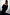 Thumbnail for Black Velvet Tilly Dress with an off-the-shoulder neckline and voluminous sleeves, featuring a subtle sparkle pattern.