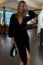 Thumbnail for Black Velvet Midi Vienna Dress with silver studs and a wrap-tie fastening on a model.