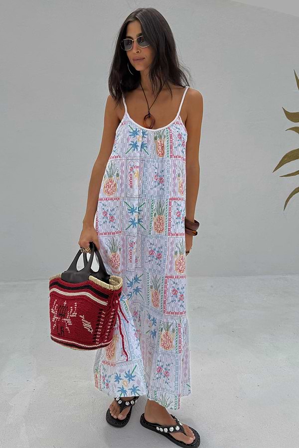 White Island Cross Stitch Maxi Dress with colourful tropical motifs and twisted rope straps.