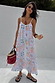 White Island Cross Stitch Maxi Dress in dobby cotton with tropical motifs and rope straps for a vacation look.