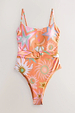 Orange Dreamer Scoop Swimsuit with celestial palm and sun prints, featuring a statement buckle and adjustable straps.