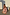 Thumbnail for Pink Sun Anais Dress with iconic soleil motifs and gold flecks, shown on a model crouching by white vases.