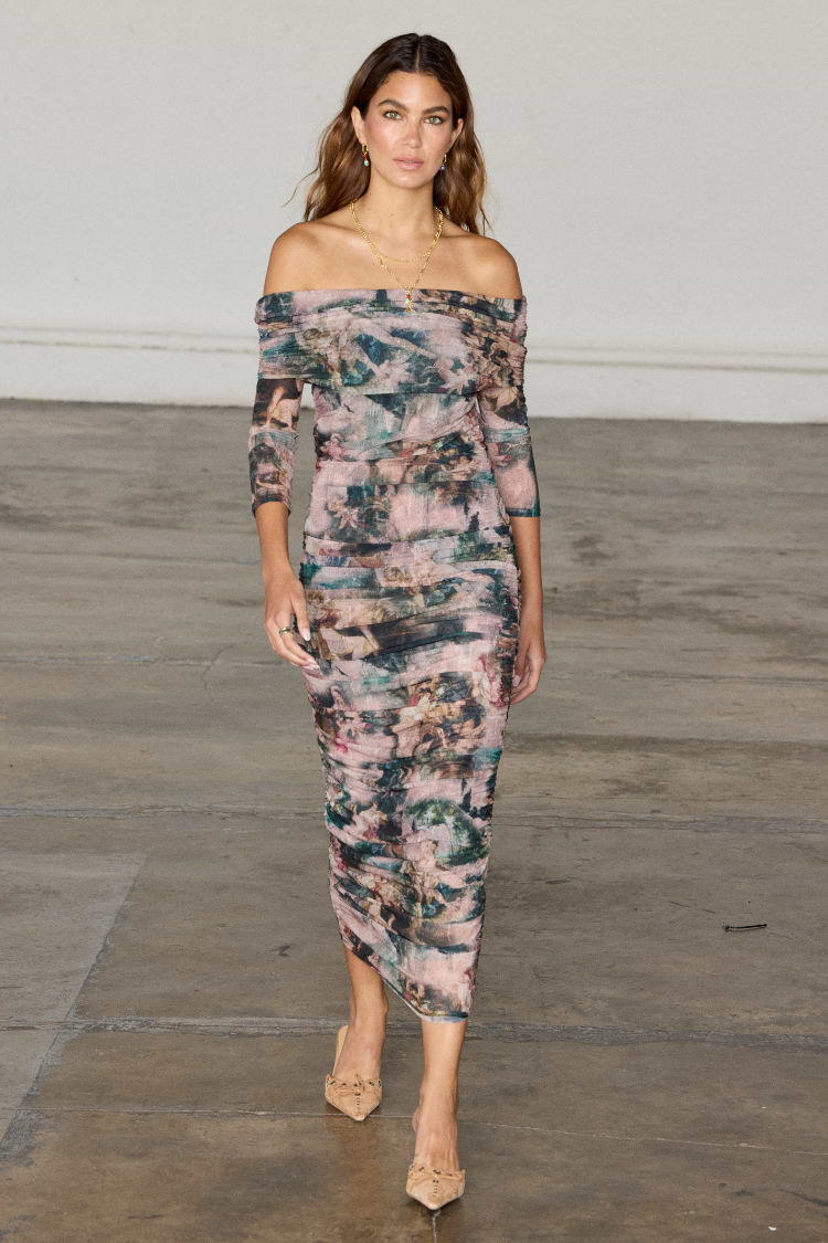 model is wearing the romantc off the shoulder diaz dress