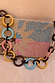 Soleil Bag featuring hand-embellished pastel beading in a sun print and a chunky multi-coloured circular link strap.