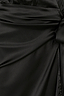 Close-up detail of the black satin fabric and waist tie on the Sleeveless Vienna Wrap Dress.