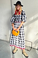 Monochrome Gingham Macy Midi Dress with ruffled sleeves and rickrack trim, styled with a black hat and leopard sandals.