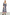 Thumbnail for Monochrome Gingham Macy Midi Dress in cotton with colourful rickrack trim and ruffled blouson sleeves on a model.