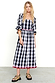 Monochrome Gingham Macy Midi Dress in cotton with colourful rickrack trim and ruffled blouson sleeves on a model.