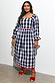 Model wearing the monochrome Gingham Macy Midi Dress with ruffled blouson sleeves and colourful rickrack trim.