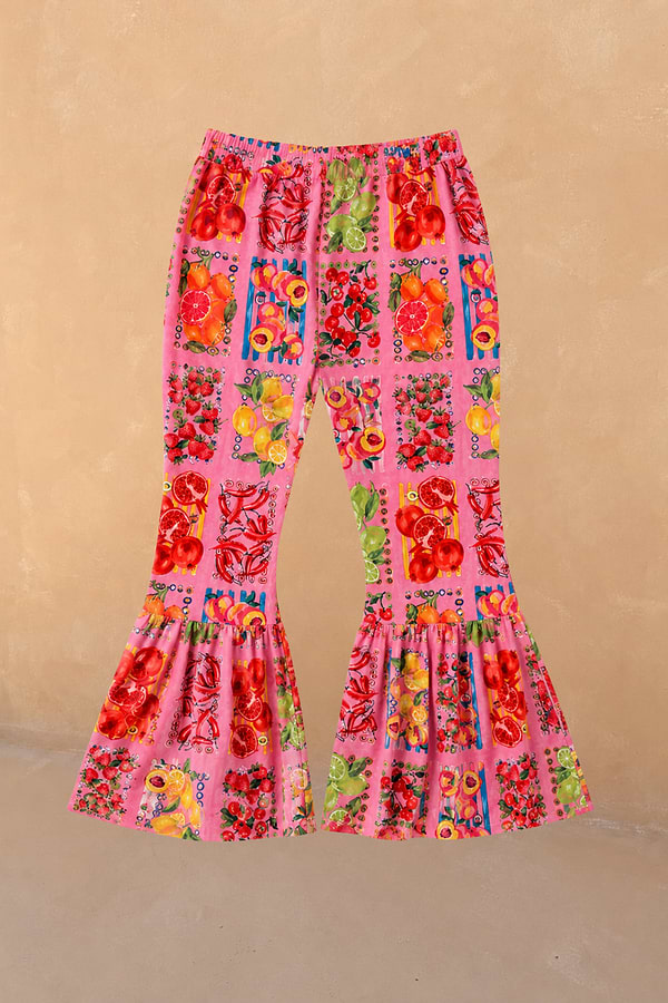 NFD Kids pink fruit print cotton trousers featuring a wide leg and statement gathered frill hems.