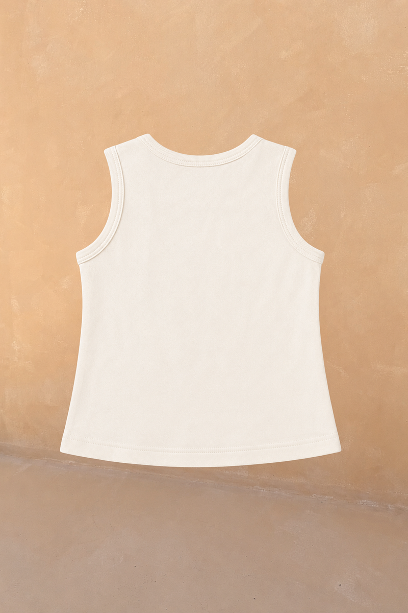 Back view of the cream cotton sleeveless vest from the Girl's Yellow Sun Set, designed in London.