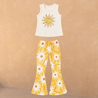 Cream cotton vest with a sequin sun and matching flared trousers in a yellow soleil print.