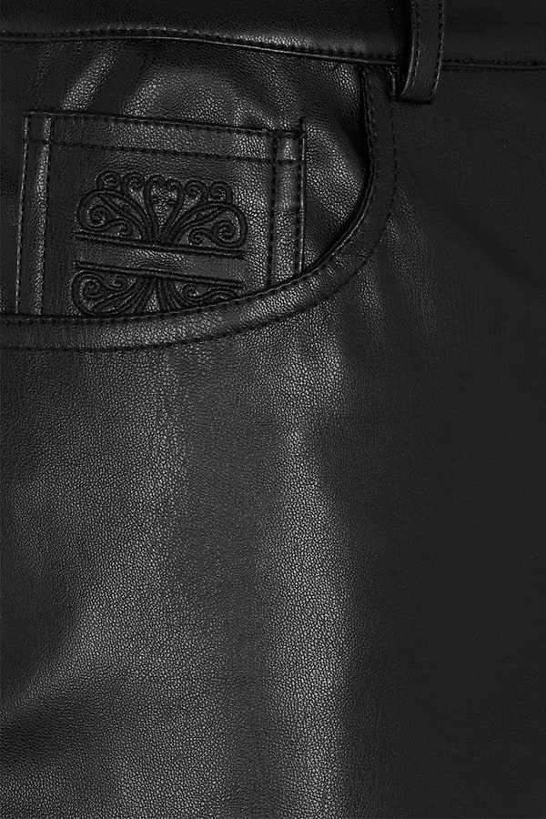 Black Vegan Leather Trousers featuring a detailed scroll motif on the front pocket.