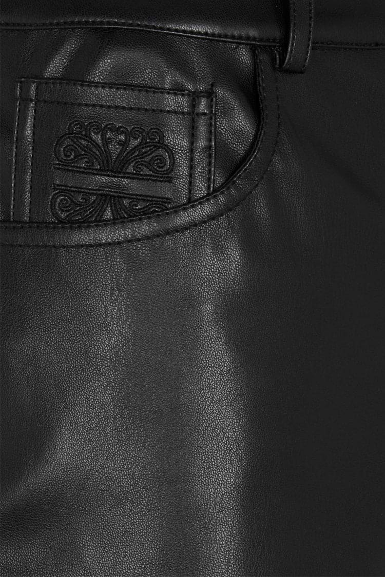 Black Vegan Leather Trousers featuring a detailed scroll motif on the front pocket.