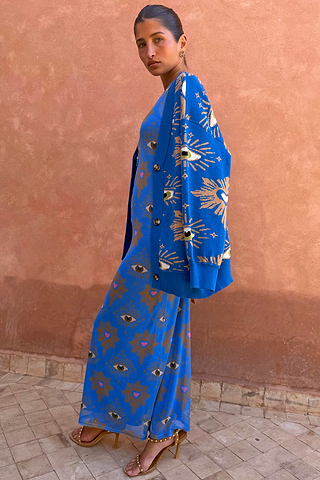 Blue Eye Mesh Dress and matching cardigan featuring eye motifs in a fitted maxi silhouette.