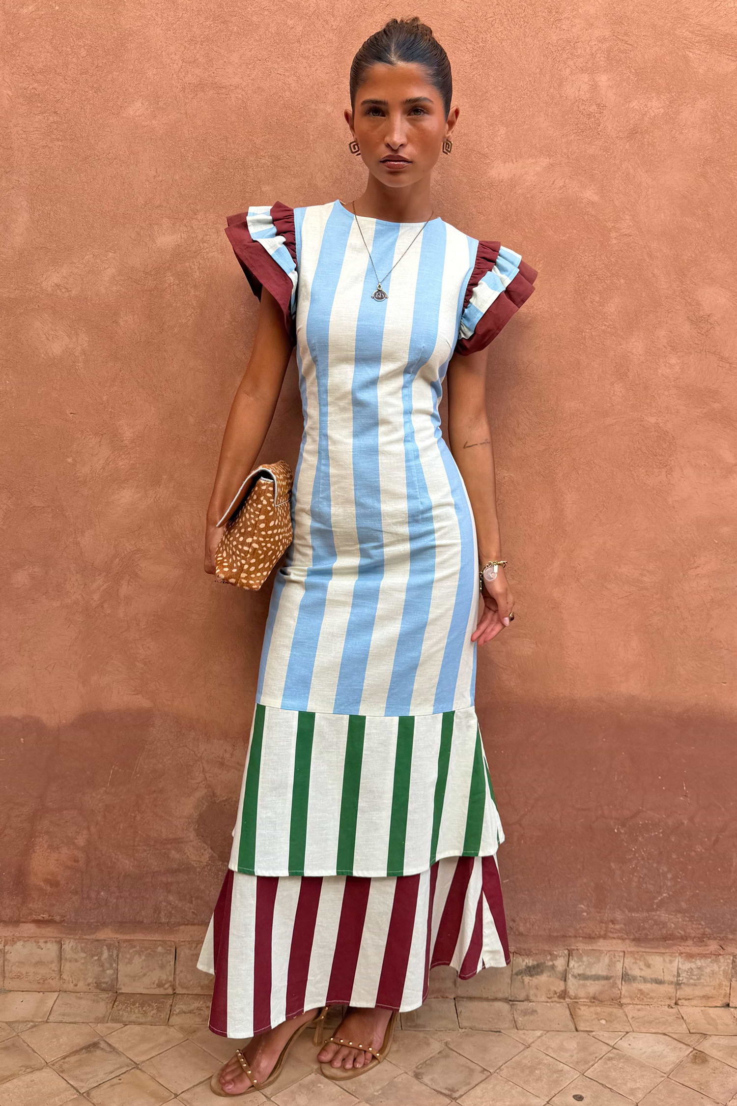 Blue Stripe Alena Midi Dress with green and burgundy tiered stripes and frill sleeves on a model.