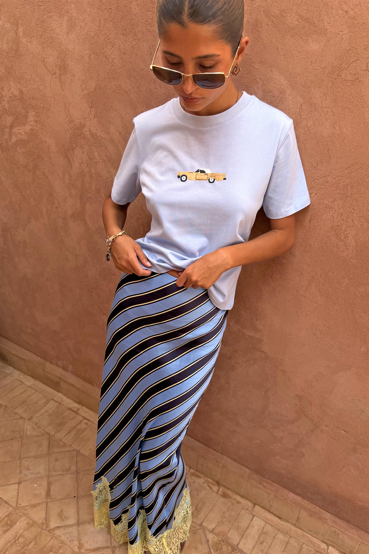 Cadillac Baby T-Shirt in blue cotton with a retro car motif, styled with a striped slip skirt.