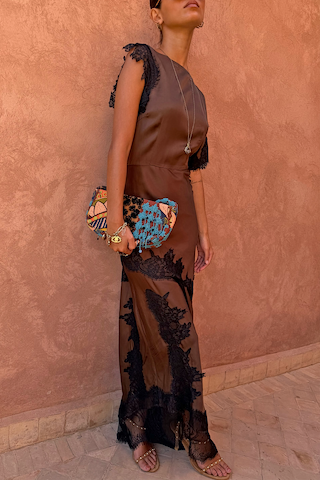 Chocolate Fearne maxi dress with black lace panels and cap sleeves, styled with a beaded clutch bag.