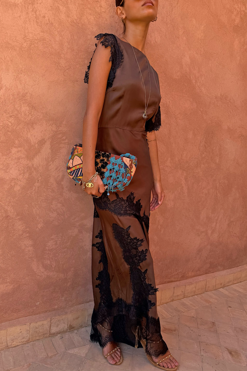 Chocolate Fearne maxi dress with black lace panels and cap sleeves, styled with a beaded clutch bag.
