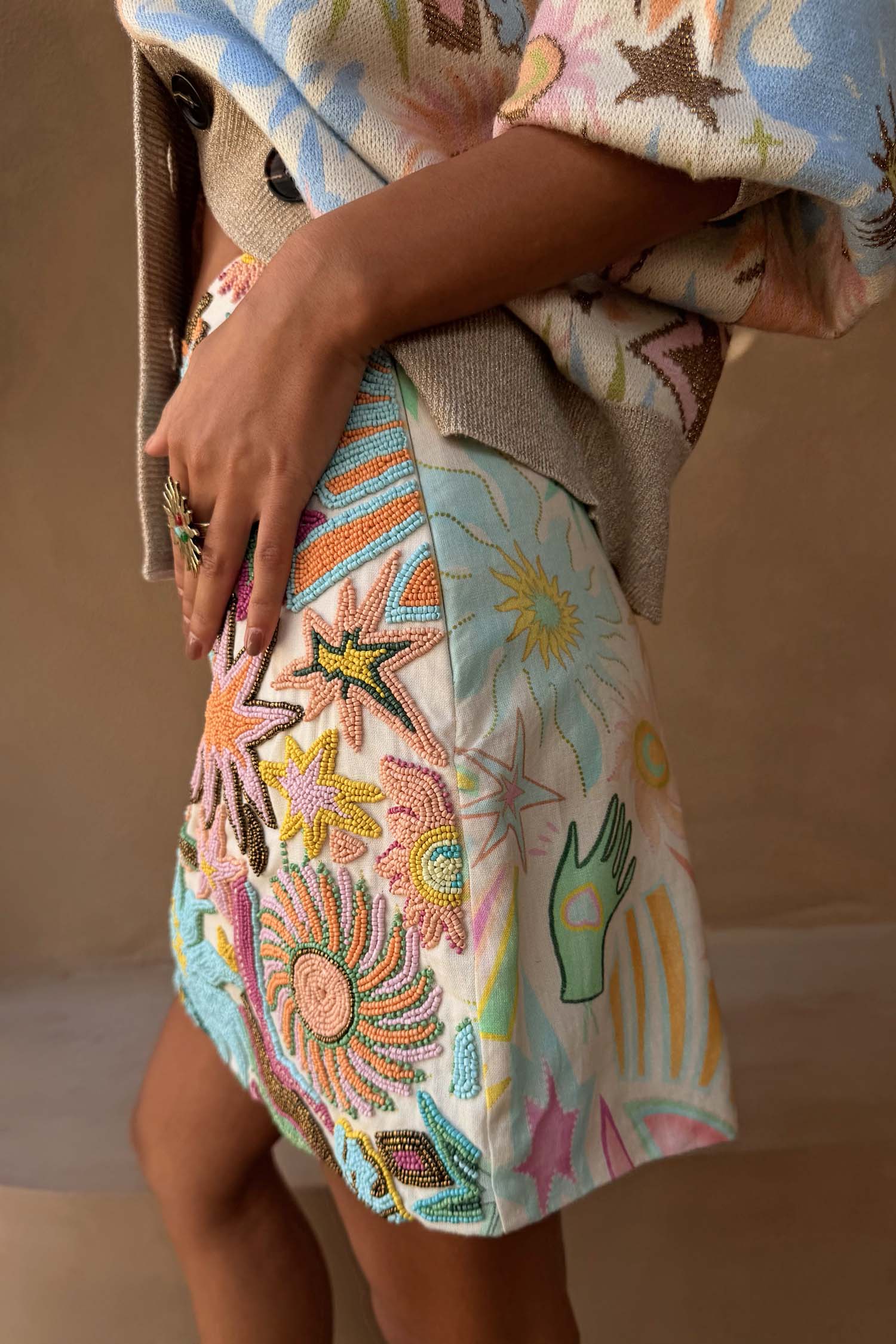 White Star Beaded Dreamer Skirt with hand-embroidered pastel sun and star motifs in glass beads.
