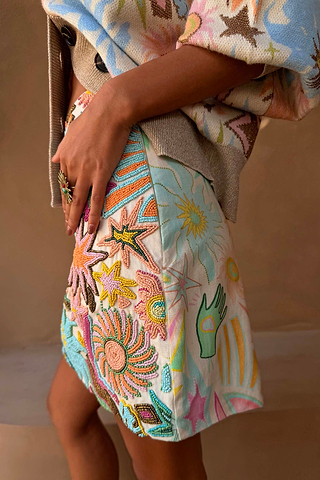 White Star Beaded Dreamer Skirt with hand-embroidered pastel sun and star motifs in glass beads.