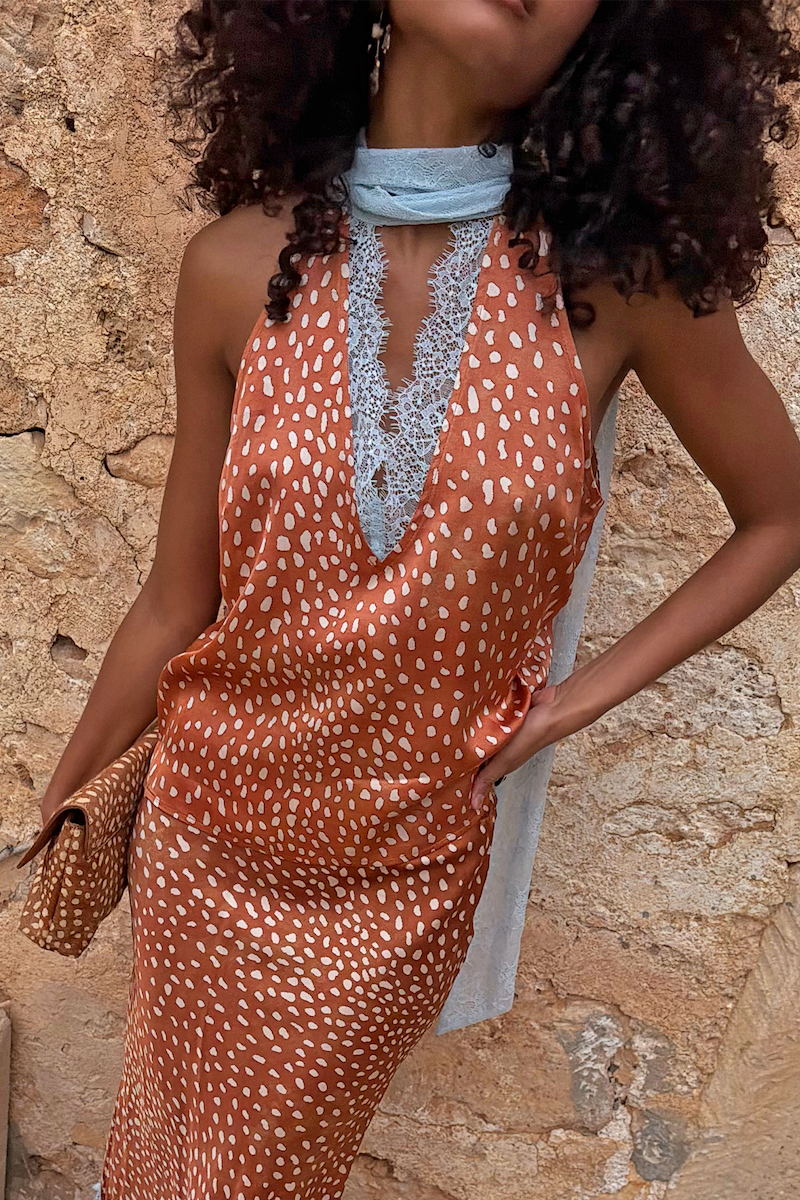 Multi-wear Fawn Lily Top in brown fawn print featuring light blue lace neck ties and a deep V-neckline.