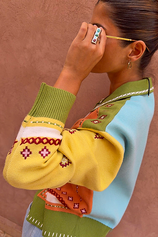 Green Geometric Palm Cardigan in a colourful jacquard knit with palm motifs and white blanket stitch detail.