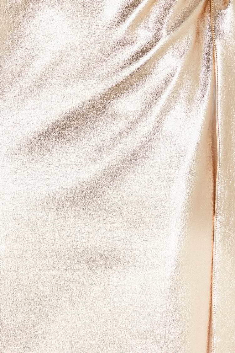 Close-up of the textured metallic gold vegan leather fabric on the iconic Jaspre wrap skirt.