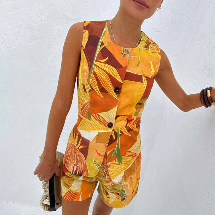 Verano Tate Shorts and co-ord waistcoat featuring an orange tropical palm and sun print in a cotton-linen blend.